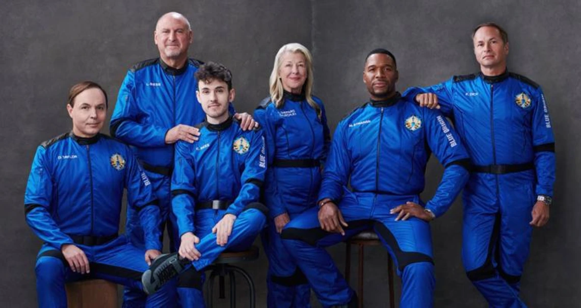 5 people in space suits